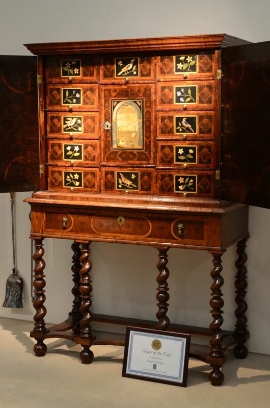 A rare late seventeenth-century English cabinet decorated with pieta dura panels on the stand of London furniture dealer Frank Partridge at the British Antique Dealers' Association Fair in Chelsea in March. Priced at £285,000 ($455,630), it was awarded the Gold Medal for 'Object of the Fair'. Image courtesy Frank Partridge and BADA Fair.